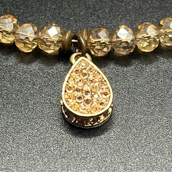 Modern light amber colored crystal choker with a teardrop rhinestone pendant. - Picture 3 of 9